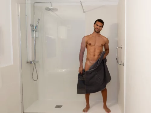 Sexy man in the shower of the gay massage parlor in Maspalomas